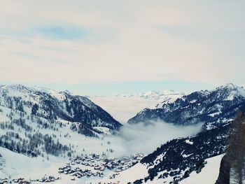 Scenic view of snow covered mountains