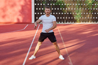 Low section of man playing golf