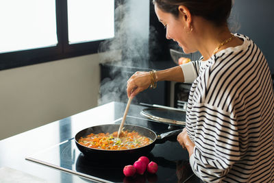 Man preparing food in kitchen