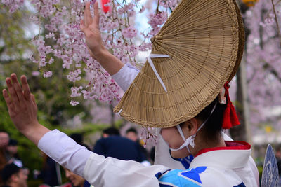 Side view of woman in traditional clothing dancing at park
