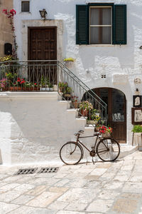 Bicycle parked outside building