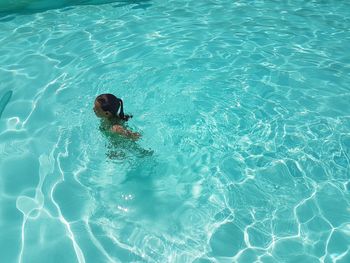 Boy swimming in pool