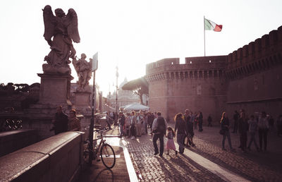 Group of people in front of historical building