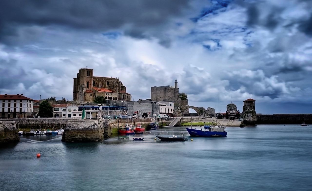 water, built structure, architecture, cloud - sky, building exterior, sky, nautical vessel, transportation, mode of transportation, waterfront, building, river, nature, city, no people, travel destinations, day, dusk, outdoors, passenger craft