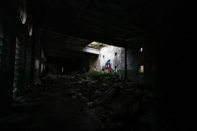 Man standing in abandoned building