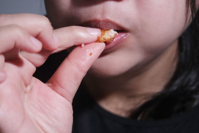 Close-up of woman eating apple