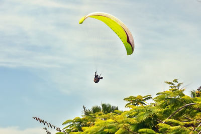 Low angle view of kite flying against sky