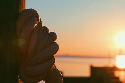 Close-up of sea against sky during sunset