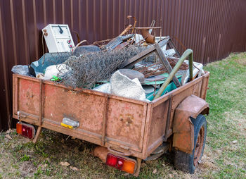 Abandoned garbage can in field