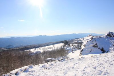 Scenic view of snowcapped mountains against sky