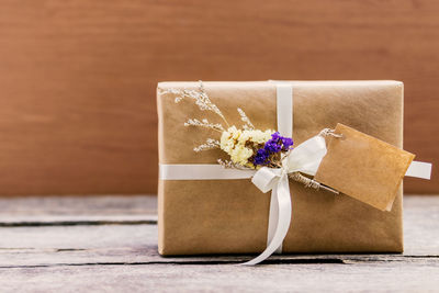 Close-up of flower on wooden table