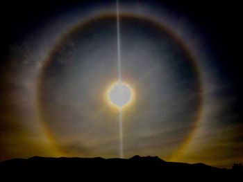 Scenic view of silhouette moon against sky during sunset