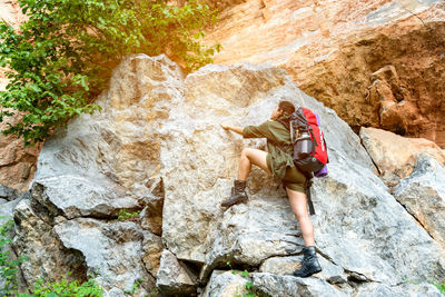 Full length of man standing on rock