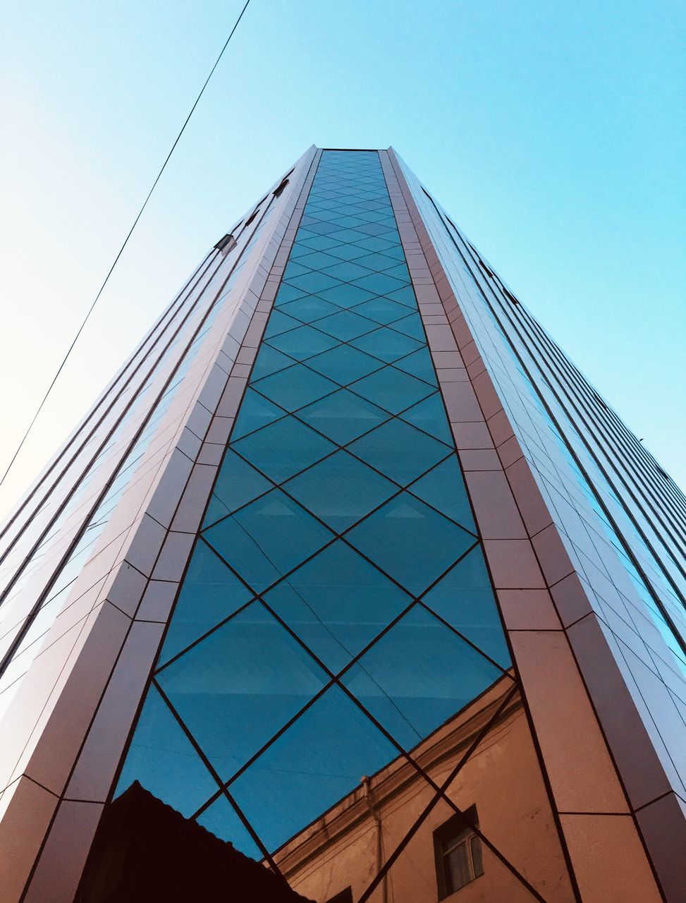 architecture, built structure, low angle view, building exterior, sky, building, city, office building exterior, modern, no people, tall - high, glass - material, skyscraper, clear sky, office, reflection, day, nature, tower, blue, outdoors, glass, directly below