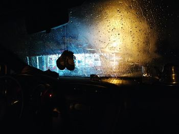 Man seen through car window at night