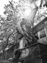 Low angle view of statue against building