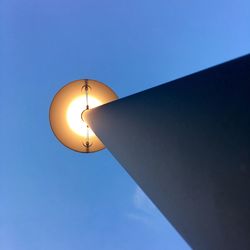 Low angle view of lamp post against sky