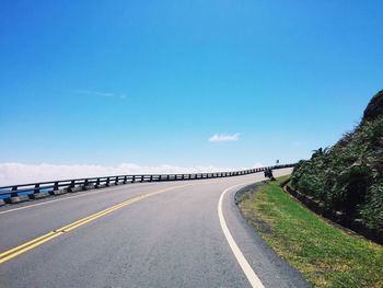 Highway against clear blue sky