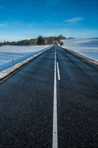 Road in frosty landscape with rime frost, denmark