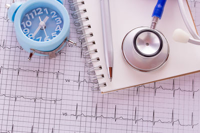 High angle view of clock on table