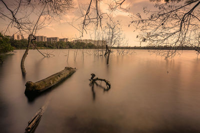 Scenic view of lake against sky during sunset