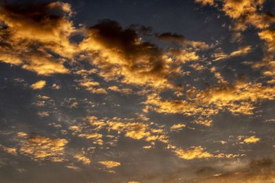 Low angle view of dramatic sky during sunset