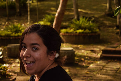 Close-up portrait of a smiling young woman