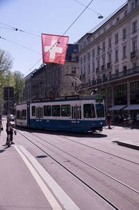 Train on railroad tracks in city