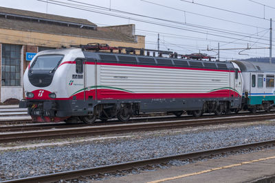 Train on railroad tracks against sky