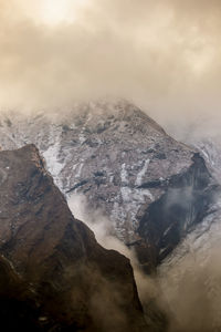 Aerial view of snowcapped mountains against sky