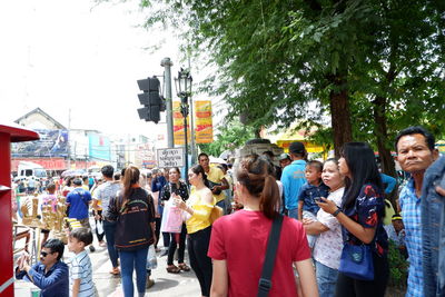 People standing on street in city