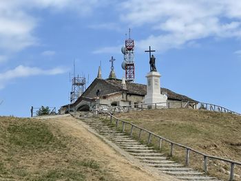 Tower amidst buildings against sky