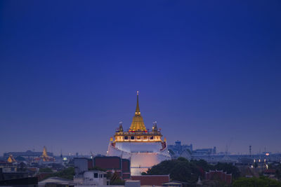 Cathedral of buildings against blue sky