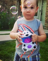 High angle view of cute girl standing at bubbles