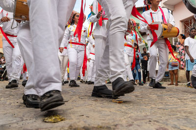 Low view of the legs of marujada de curaca members dancing at the chegancas cultural meeting