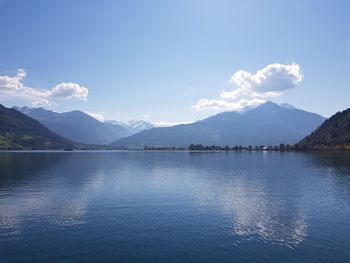 Scenic view of lake and mountains against sky