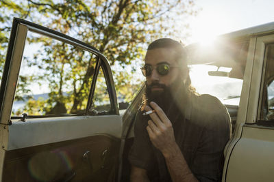 Handsome young man smoking a cigarette