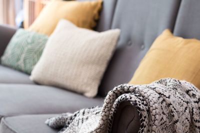 Close-up of shawl on sofa at home