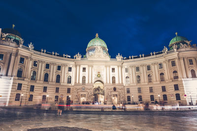 Facade of historical building against sky in city