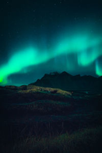 Scenic view of mountains against sky at night