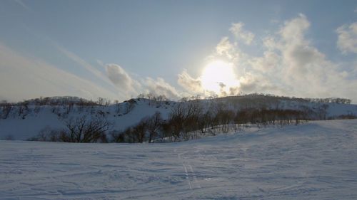 Scenic view of snowcapped landscape against sky