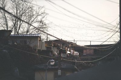 Canal amidst buildings against sky