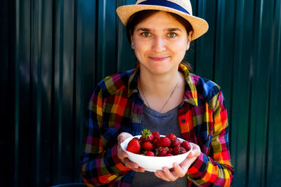 Portrait of young woman wearing hat