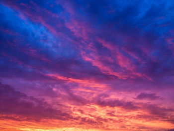 Low angle view of dramatic sky during sunset