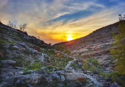 Scenic view of mountains against sky during sunset