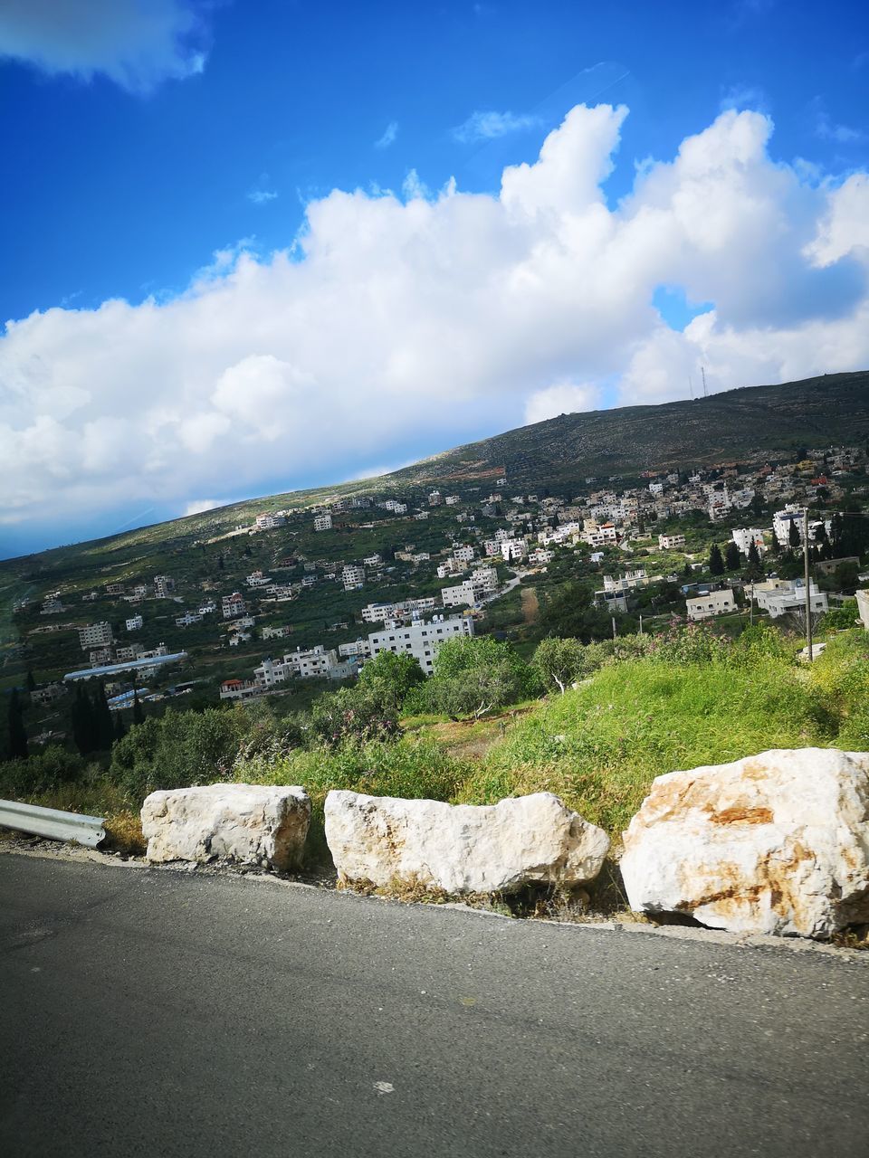 ROAD BY MOUNTAIN AGAINST SKY