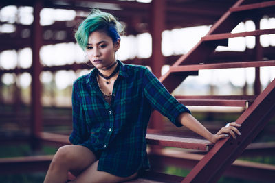 Portrait of beautiful young woman in city