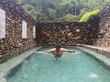 Man swimming in pool