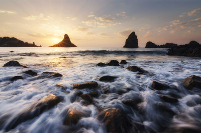 Scenic view of sea against sky during sunset