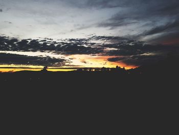 Scenic view of silhouette landscape against sky during sunset